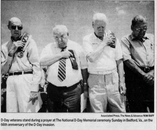 D-Day veterans stand during a prayer
